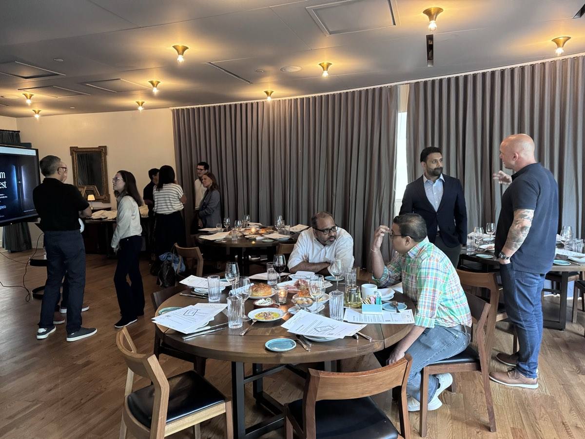 Guests in conversation at a dinner event